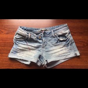 Ripped and splattered denim shorts